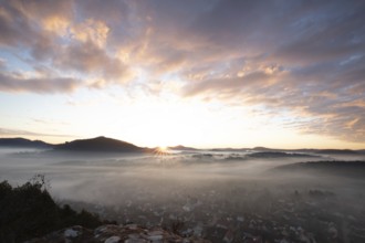 Mystical sunrise at the Wachtfelsen. Fascinating landscape shot between fog and clouds near