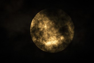 Super moon one day after full moon, moon behind clouds, Braunschweig, Lower Saxony, Germany, Europe