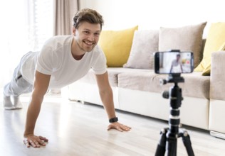 handsome male recording personal training home