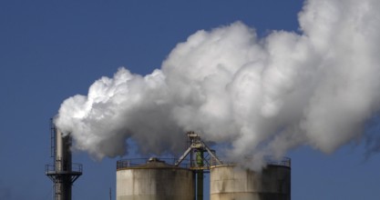 Smokestack of Sugar Refinery with Water Vapour, Near Caen in Normandy