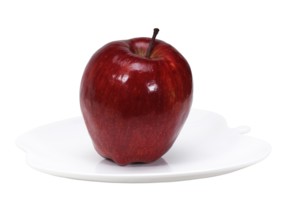 Red apple on a apple shaped dish isolated over white