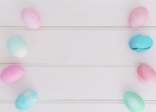 Rows bright easter eggs desk