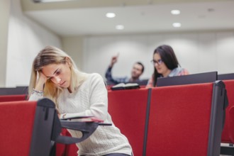 Group students sitting boring seminar