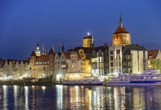 The harbour district on the Motlawa river, Motlawa, in the city centre of Gdansk, illuminated in