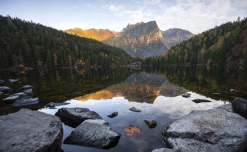 Mountain peaks of the Ötztal Alps reflected in Lake Piburger See, in autumn, near Ötz in Ötztal,