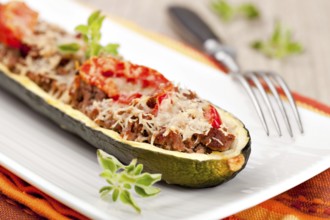 Zucchini halves stuffed with minced meat and vegetable