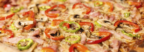 Close up pizza with red pepper ingredients