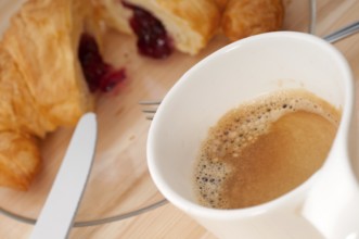 Fresh croissant french brioche and coffee typical traditional Italian breakfast