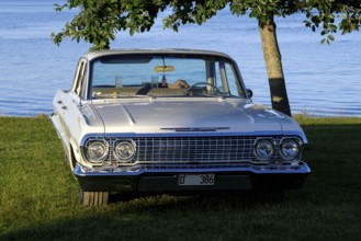 American classic car, Chevrolet Bel Air from 1963, behind the lake Glafsfjorden, Arvika, Värmland,