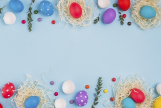 Easter eggs nests with plant branches candies