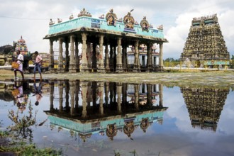 Thillai Natraja temple north tower and mandap along with its reflection in the rain water,