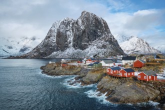 Hamnoy fishing village with red rorbu houses in Norwegian fjord in winter. Lofoten Islands, Norway,
