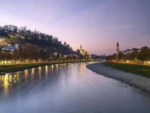 View towards Müllner church at sunset, Salzach, Salzburg, Austria, Europe