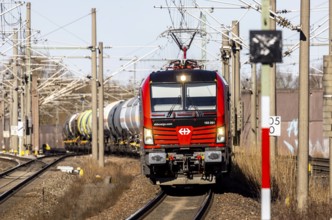 Goods train with Swiss locomotive passing through Baden-Baden station on the Rhine Valley line. SBB