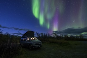 Northern lights over camper, VW California, Lyngen, Troms og Finnmark, Norway, Europe