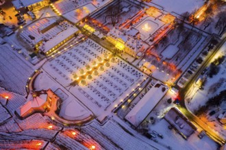 Aerial view of Wackerbarth Castle with castle park, belvedere and vineyards with snow and Christmas