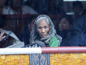Dreamy old woman, looking inwards, Tana Toraja, Sulawesi, Indonesia, Asia