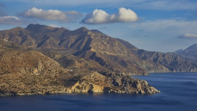 Mountains and sea under a cloudy sky, morning light, sunrise, coastal road, east coast, Karpathos,