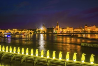 Yellow penguins, installation by the Italian artist group 'Cracking Art Group' on the Vltava River,