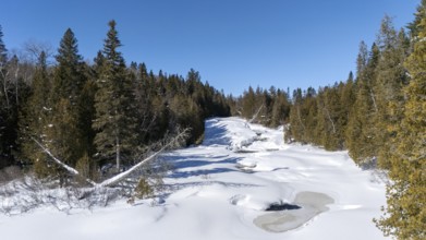 Wolf river. Frozen river in winter. Mastigouche wildlife reserve. Province of Quebec. Canada