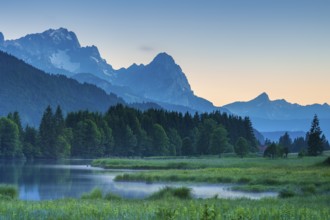 Dusk at Geroldsee, fog rising, in the background the peaks of Hochblassen, Zugspitze and