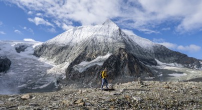 Mountaineer in front of the summit of Mont Blanc de Cheilon and glacier Glacier de Cheilon, Valais
