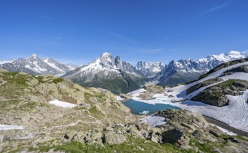 Mountain landscape with mountain lake Lac Blanc, mountain peaks, Aiguille Verte, Grandes Jorasses,
