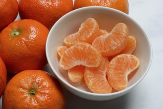 Clementines and clementine pieces in peel, clementine