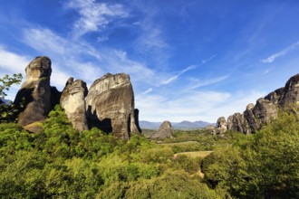 Hermitages between high rocks, monasteries on sandstone formations, Meteora, blue sky, spring
