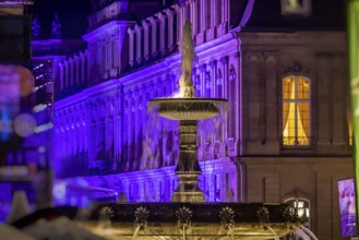 Court of honour on Schlossplatz. The New Palace and fountain are illuminated. Stuttgart,