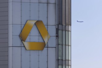 An aeroplane flies past behind the Commerzbank Tower in Frankfurt am Main, Frankfurt am Main,
