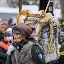 Person masked as a mountaineer at the carnival parade of the Wey guild on Rose Monday, Güdismäntig,