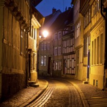 Half-timbered houses in a narrow street with cobblestones, Old Town in the evening, World Heritage