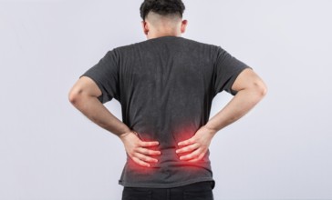 Lumbar problems concept, Sore man with back pain isolated. Man with spine problems isolated