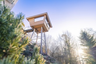 Modern tree house in natural surroundings with sunset in the background, Hotel Krone Lamm,