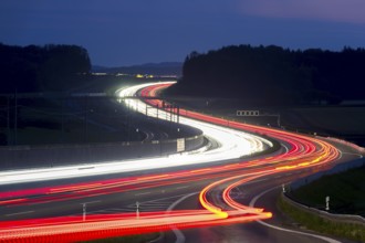 Tracers on the A8 motorway, winding road, evening, long exposure, Swabian Alb, Baden-Württemberg,