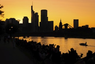 The sun sets behind the Frankfurt banking skyline, Frankfurt am Main, Hesse, Germany, Europe