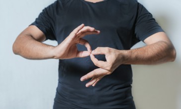 People speaking in sign language isolated. Young woman gesturing in sign language