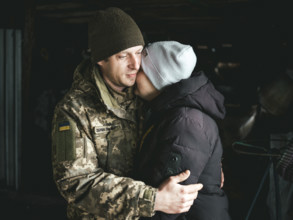 A Ukrainian soldier says goodbye to his woman after a furlough, Hroza, Ukraine, Europe