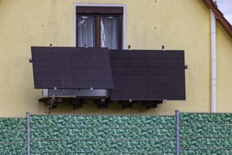 Plastic fence in leaf look on a detached house. Balcony power station. Stuttgart,