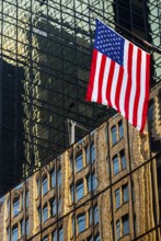 Reflections in glass facades, us national flag, stars stripes, Manhattan, New York City, USA, North