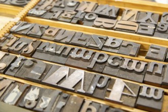 Metal block types letters of an old printing press, UK