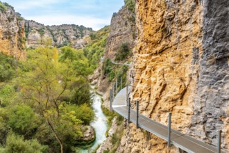 Metal walkways on the wall of the path next to the Vero River in Alquezar. Pyrenees
