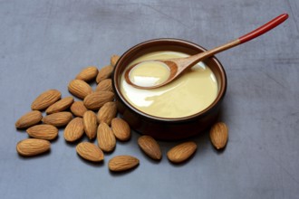 White almond cream in small bowls, almond butter