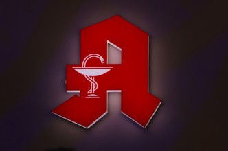 Night shot, logo, red neon sign, pharmacy sign with Aesculapian staff, Aesculapian staff,