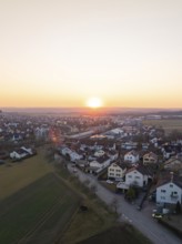 Aerial view of a village with houses and fields at sunset, peaceful atmosphere, Althengstett,