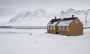 Ochre-coloured houses, research settlement, scientific settlement, wintry mountain landscape,