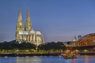 The famous Cologne Cathedral and the Rhine by night