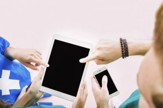 Friends holding tablet hand