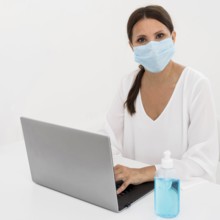 Woman wearing medical mask hand sanitizer